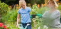 Happy grandmother with her granddaughter gardening Royalty Free Stock Photo