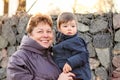 Happy grandmother holding her little grandson in her arms Royalty Free Stock Photo