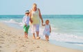 Happy grandmother with kids on beach Royalty Free Stock Photo