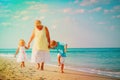 Happy grandmother with kids- little boy and girl- at beach Royalty Free Stock Photo