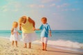 Happy grandmother with kids- little boy and girl- at beach Royalty Free Stock Photo