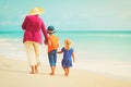 Happy grandmother with kids- little boy and girl- at beach Royalty Free Stock Photo