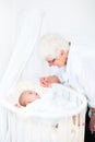 Happy grandmother talking to newborn grandson Royalty Free Stock Photo