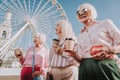 Happy grandmothers are drinking coffee on square Royalty Free Stock Photo