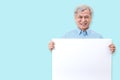 Happy grandpa smiling with white teeth, enjoy moment and holding a blank board. Asian older man showing white blank board for your