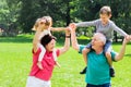 Happy Grandparents Giving Grandchildren Piggyback Ride Royalty Free Stock Photo