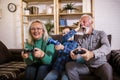 Grandparents playing video games with their grandson Royalty Free Stock Photo