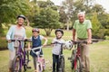 Happy grandparents with their grandchildren on their bike Royalty Free Stock Photo
