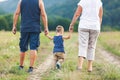 Happy grandparents on a walk with their grandchild Royalty Free Stock Photo