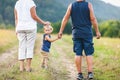 Happy grandparents on a walk with their grandchild Royalty Free Stock Photo