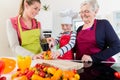 Granny showing old family recipe to grandson and daughter