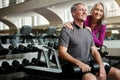 We always happy after a great workout. a senior married couple smiling and taking a break from their workout at the gym. Royalty Free Stock Photo