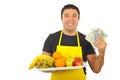 Happy greengrocer holding money Royalty Free Stock Photo