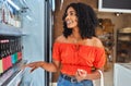 Happy, grocery shopping and woman in a supermarket with drinks at a retail store in Sao Paulo. Happiness, smile and girl Royalty Free Stock Photo