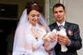 Happy groom and bride holding wedding pigeons Royalty Free Stock Photo