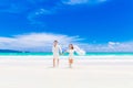 Happy groom and bride on the sandy tropical beach. Wedding and h Royalty Free Stock Photo