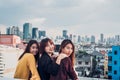 Happy group of asia girl friends enjoy relax pose at roof top pa