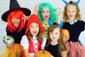 Happy group of children in costumes during Halloween party