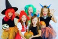 Happy group of children in costumes during Halloween party