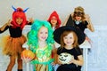 Happy group of children in costumes during Halloween party