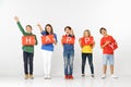 Happy. Group of children with red banners isolated in white Royalty Free Stock Photo