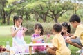 Happy group of cute little children girls painting Easter eggs together. Diverse kids holding painting brush, painting watercolor Royalty Free Stock Photo