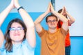 Disabled people raising arms practicing yoga in the gym Royalty Free Stock Photo