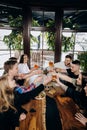 Happy group of friends drinking and clinking with beer and cocktails at brewery bar restaurant Royalty Free Stock Photo