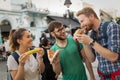 Happy group of people eating pizza outdoors Royalty Free Stock Photo