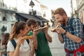Happy group of people eating pizza outdoors Royalty Free Stock Photo