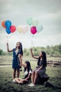 Happy group girl friends hand holding multicolored