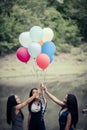 Happy group girl friends hand holding multicolored Royalty Free Stock Photo