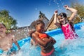 Cute happy girl pose with friends in the pool Royalty Free Stock Photo