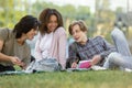 Happy group of multiethnic students studying outdoors Royalty Free Stock Photo