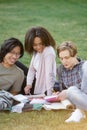 Happy group of multiethnic students studying outdoors Royalty Free Stock Photo
