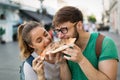 Happy group of people eating pizza outdoors Royalty Free Stock Photo