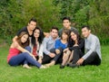 Happy group of students sitting at the park Royalty Free Stock Photo