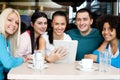 Happy group of teenagers with tablet Royalty Free Stock Photo