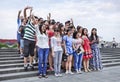 Happy group of tourists at Bund Boulevard, Shanghai, China