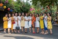 Happy group of Vietnamese women outdoors in Hoi An Old Town, Vietnam