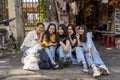 Happy group of Vietnamese young girls outdoors in Hoi An Old Town, Vietnam