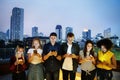 Happy group of young adults using smartphones Royalty Free Stock Photo