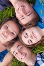 Happy group of Young people & green grass Royalty Free Stock Photo