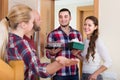 Happy guests in doorway Royalty Free Stock Photo