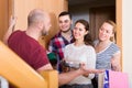 Happy guests in doorway Royalty Free Stock Photo