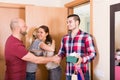 Happy guests in doorway Royalty Free Stock Photo