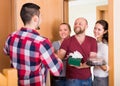 Happy guests in doorway Royalty Free Stock Photo