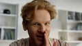 Happy guy enjoy conference at home closeup. Happy ginger husband telling secrets Royalty Free Stock Photo