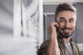 Happy guy enjoying pleasant conversation Royalty Free Stock Photo