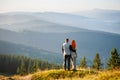 Happy guy and girl in the mountains in the morning Royalty Free Stock Photo